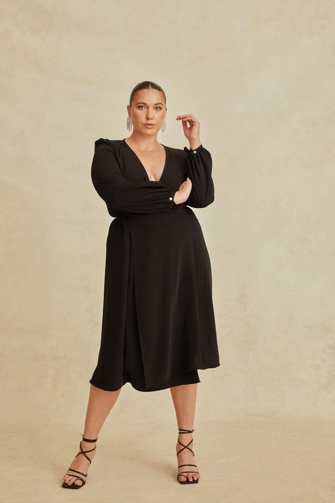 full length view black wrap dress with thigh split and long sleeves